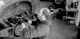 Black and white image of an auto technician at Hopkins Tire and Auto
